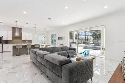 Great room opening to the pool